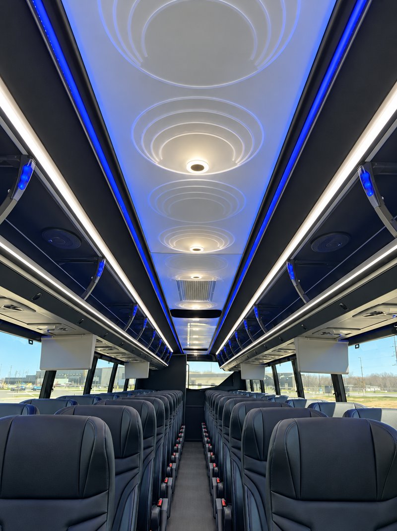 Coach ceiling with circular light details and blue accent lighting